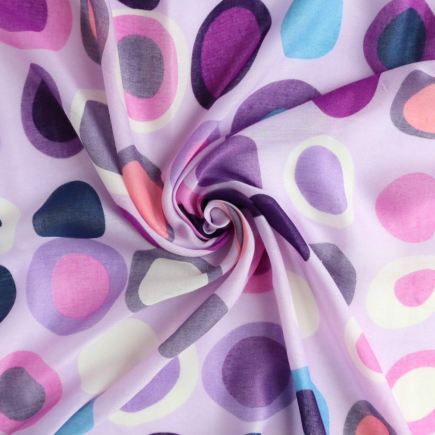 Soft lilac scarf fabric with a bold, retro circle pattern in shades of purple, pink, blue, and cream. Lightweight, flowing material with a central swirl.