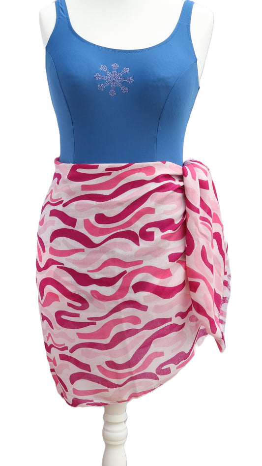 Pink and white patterned sarong tied at the hip. Lightweight, semi-sheer fabric with wavy stripes in varying shades of pink.