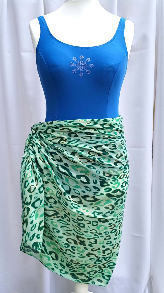 Green and white leopard print beach wrap tied at the side. Lightweight, semi-transparent fabric with a soft, gathered effect.