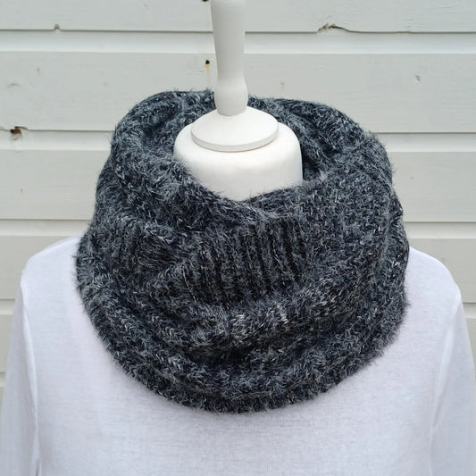Charcoal grey knitted snood scarf wrapped twice around a mannequin