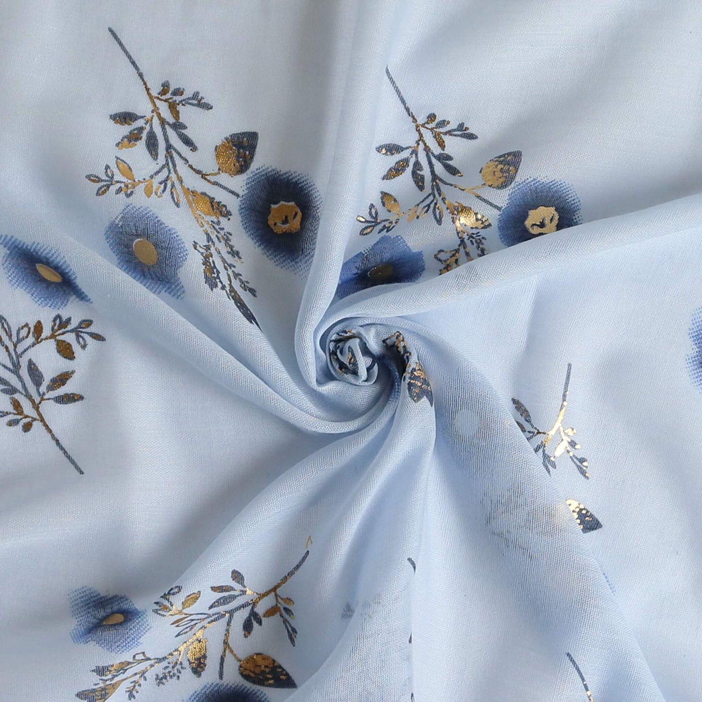 Aurora's Array: Close-up of a soft, lightweight light blue scarf with a small blue and gold floral print, swirled to show detail.