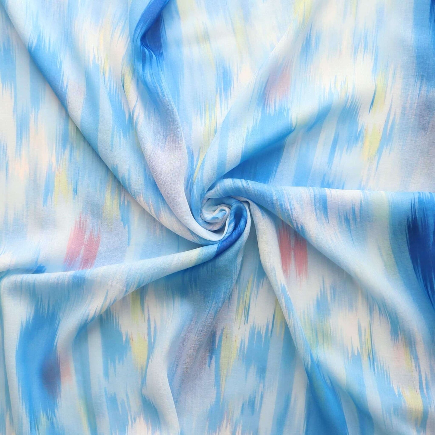 Lightweight scarf fabric with an abstract ikat-inspired pattern in flowing strokes of blue, white, with hints of yellow and pink.