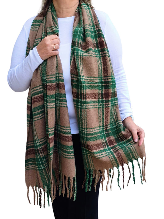 Aurora's Array: Woman models a soft, oversized tartan scarf in shades of brown, green with a fringed edge.