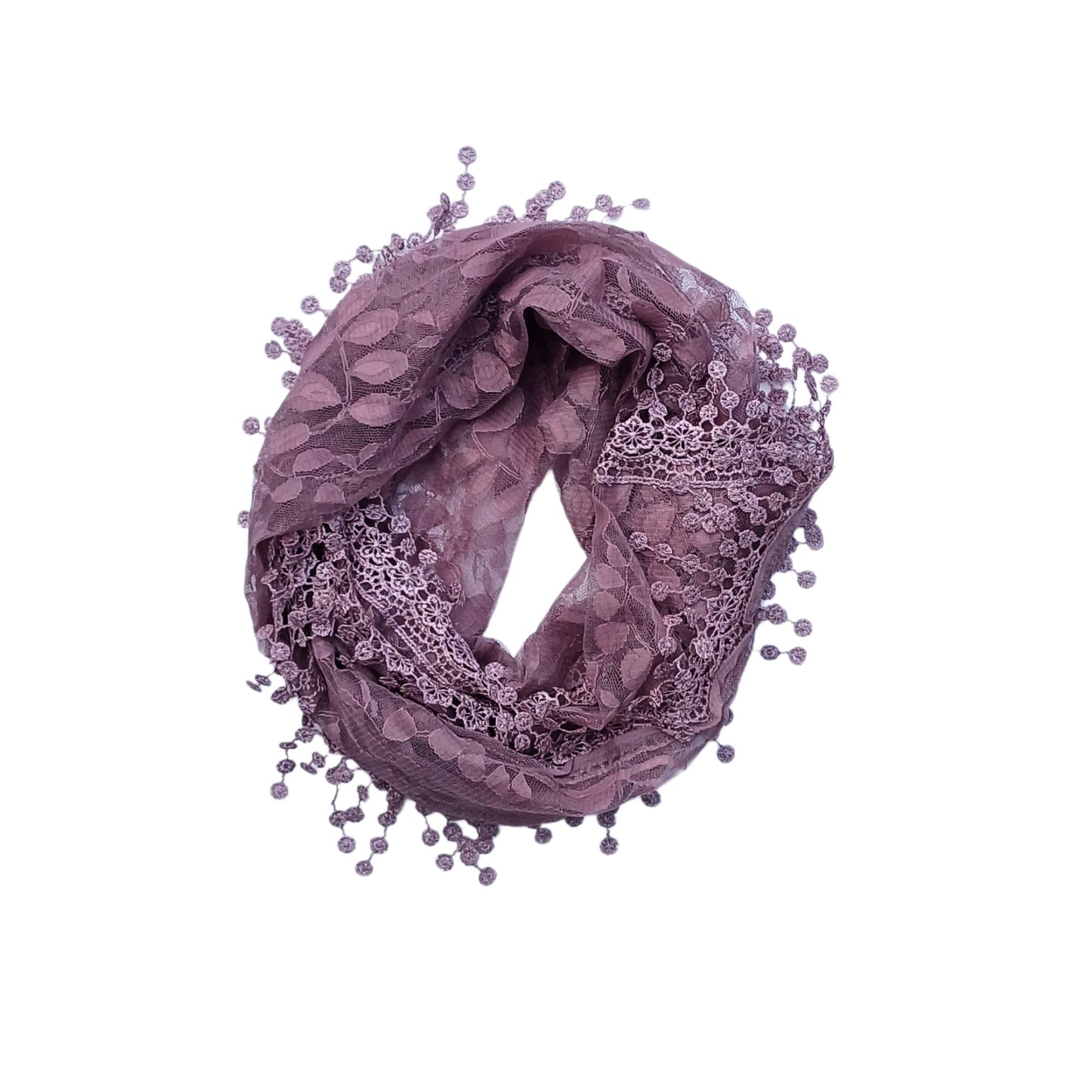 Aurora's Array: A sophisticated dusty pink scarf made of delicate lace with a subtle floral pattern and beaded fringed edges, gathered in a circular shape.