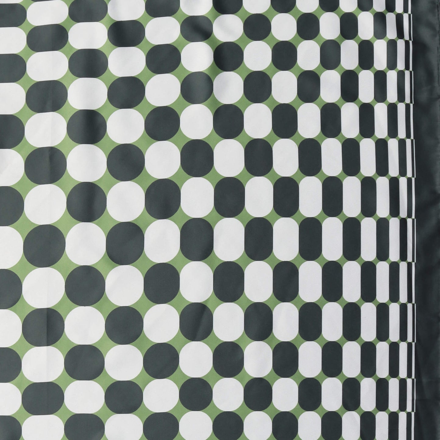 Aurora's Array: Close-up of a small square satin scarf with a geometric pattern of white dots on a dark green background, featuring a border design of clustered white dots on the right edge.