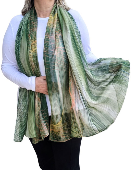 woman wearing green fine stripe print lightweight scarf with sheer flowy fabric and natural pattern