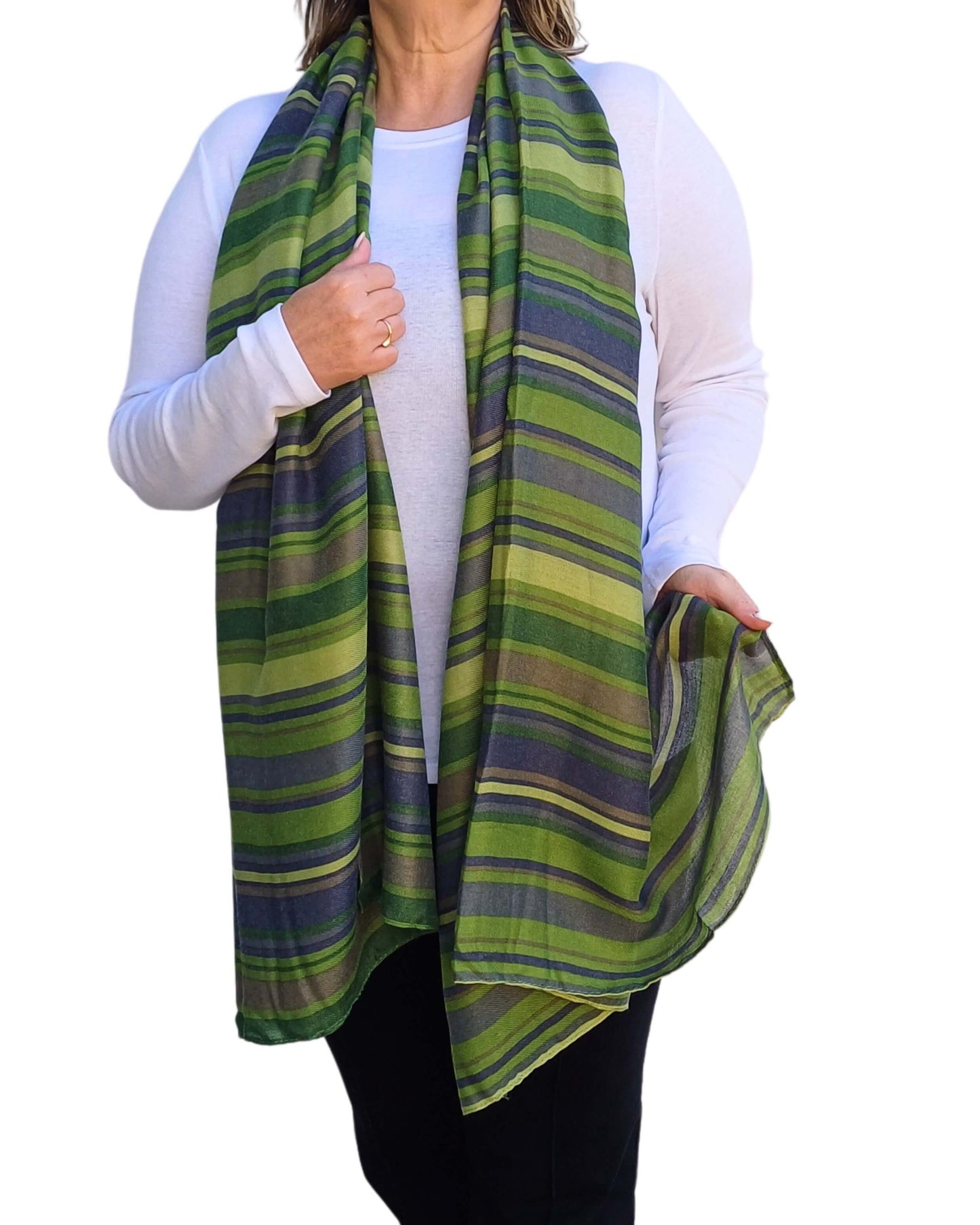 Aurora's Array: Woman models a soft, striped scarf in shades of green.
