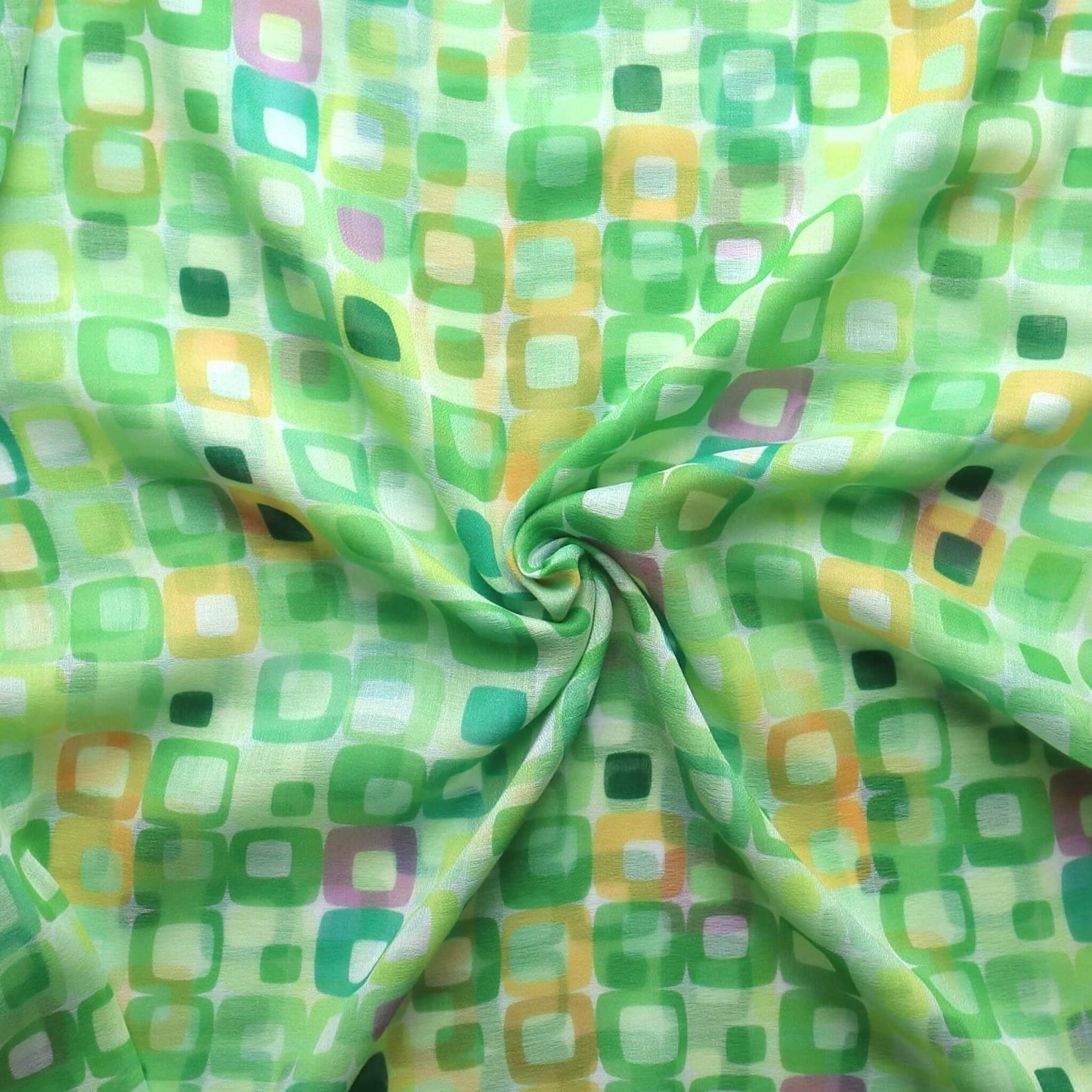 Lightweight scarf fabric with a colourful geometric square design in shades of green, yellow, pink and white. Soft summer textile.