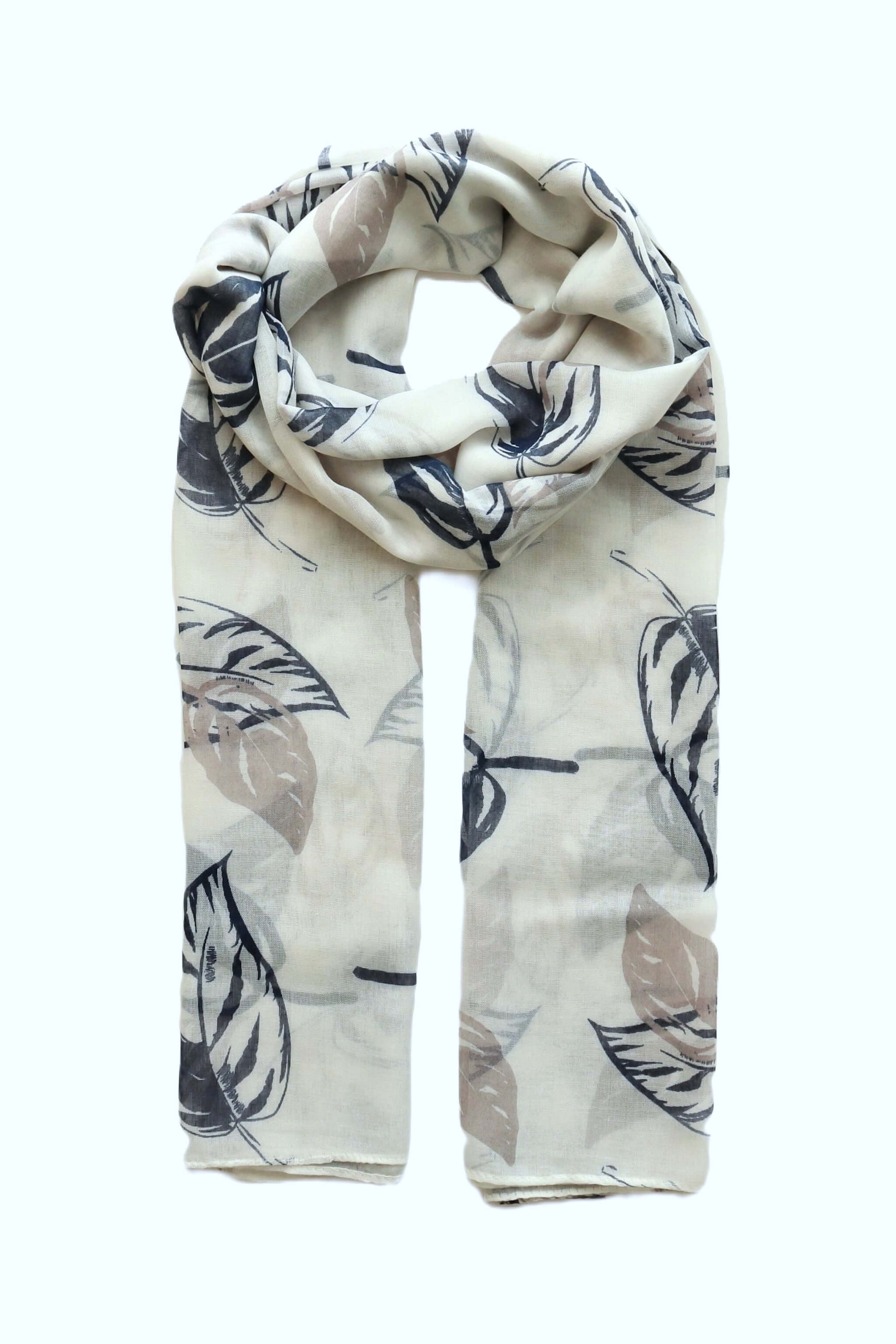 Aurora's Array: Soft, lightweight scarf with a giant leaf print in shades of grey, blue, and beige on a cream background, styled in a loop.