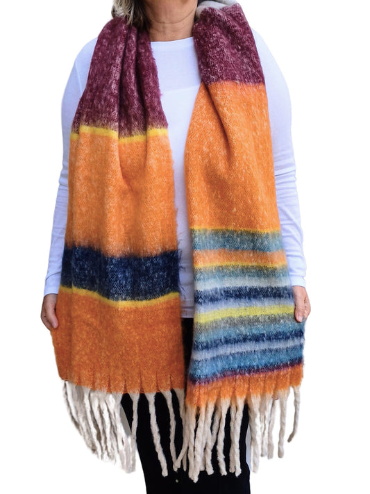 Aurora's Array: Fluffy, multi-striped scarf in shades of burgundy, yellow, orange, and blue, featuring long white tassels at the ends.