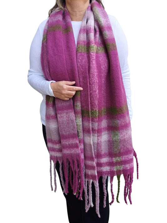 Aurora's Array: Fuchsia Pink Cosy Large Check Blanket Wrap Tassel Scarf from Aurora's Array. Luxurious and oversized, this scarf features a beautiful pink, cream, and muted olive green check pattern with soft fringed tassels. Add a touch of warmth and sty