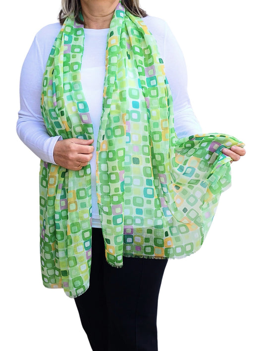 Lightweight summer scarf with a colourful geometric square pattern in shades of green, yellow, pink and white. Stylish and airy.