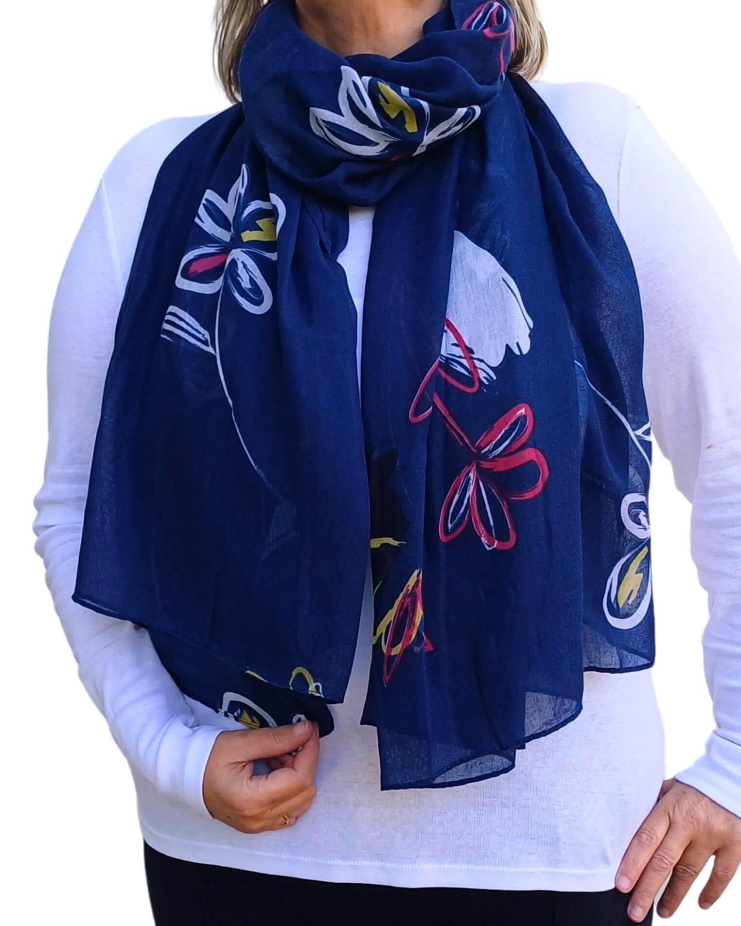 Aurora's Array: Stylish lightweight oversized scarf featuring an abstract floral sketch design in navy blue, white, pink, and yellow, worn draped by a woman.