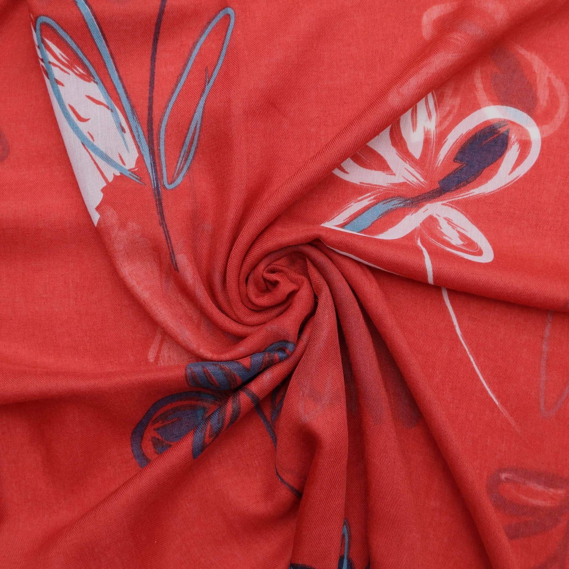 Aurora's Array: Close-up of a soft, lightweight scarf with an abstract floral sketch print in shades of red, white, navy, and teal, swirled to show detail.