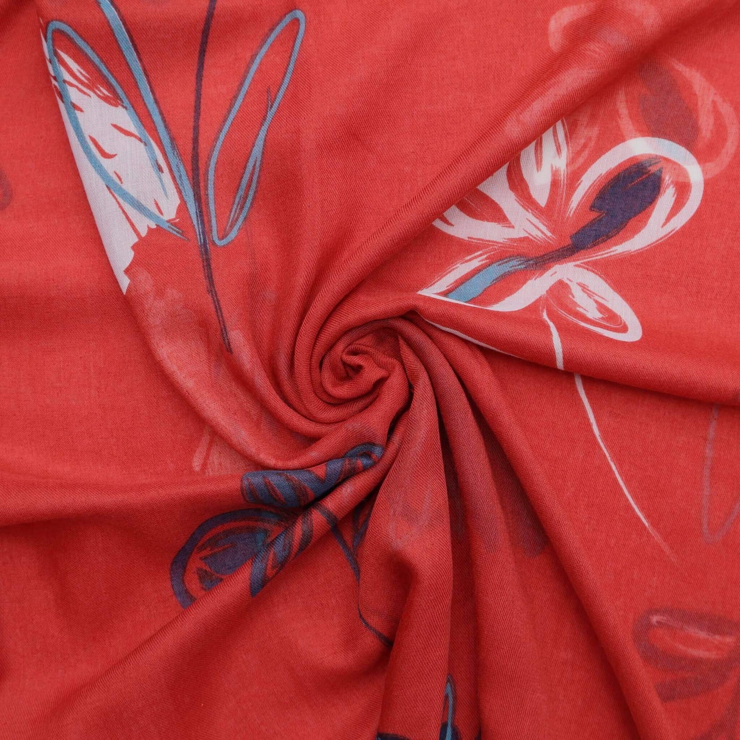 Aurora's Array: Close-up of a soft, lightweight scarf with an abstract floral sketch print in shades of red, white, navy, and teal, swirled to show detail.