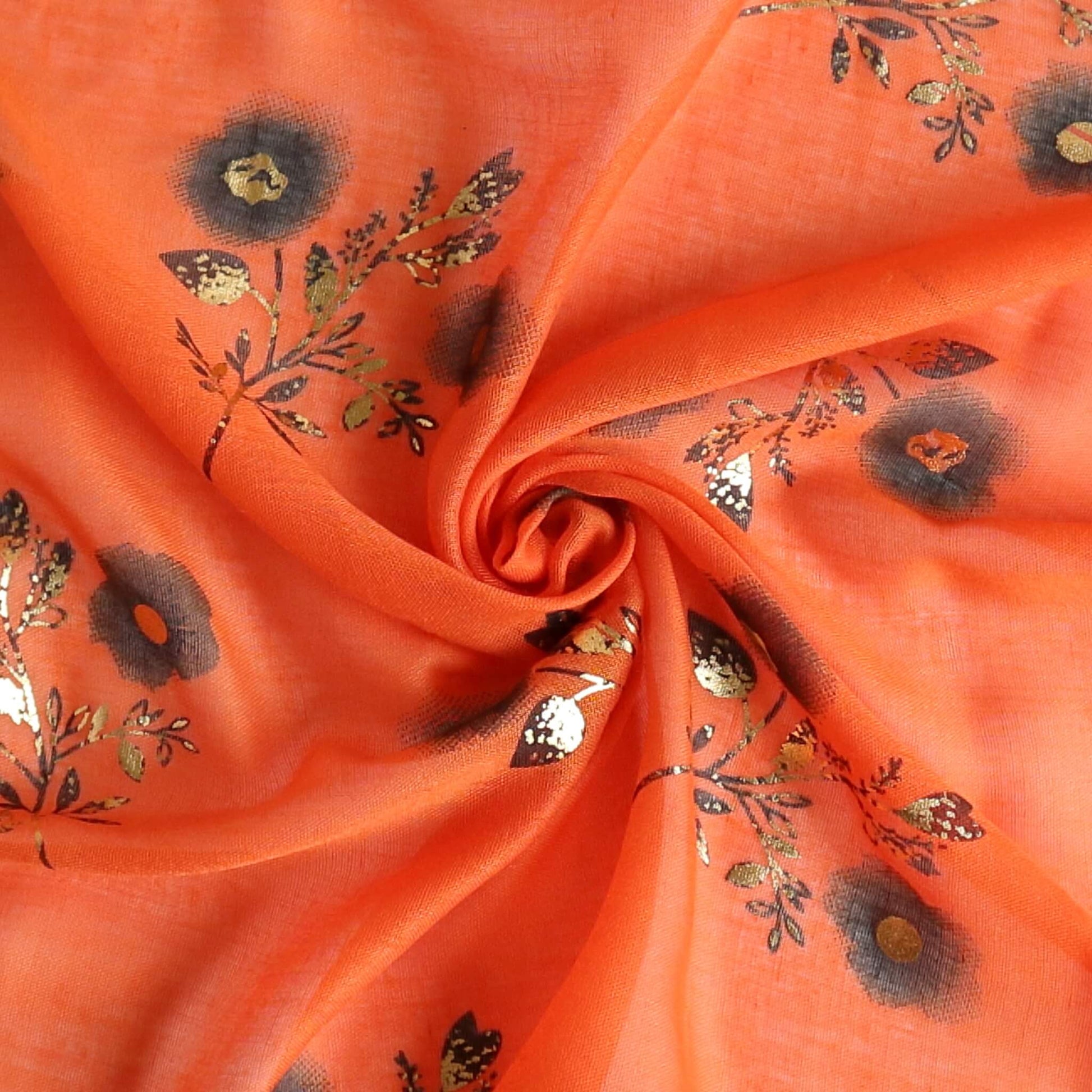 Aurora's Array: Close-up of a soft, lightweight bright orange scarf with a small black and gold floral print, swirled to show detail.