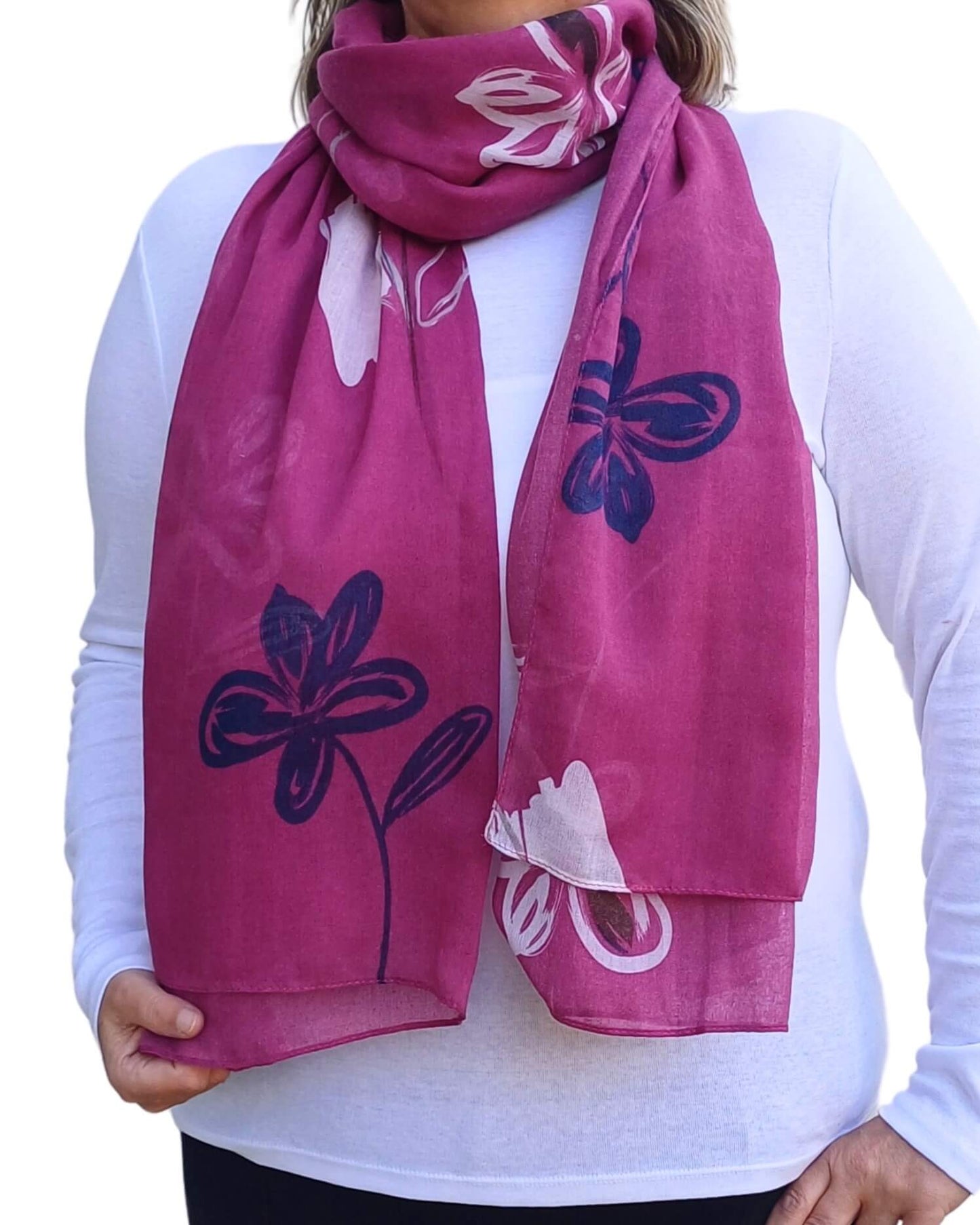 Aurora's Array: Woman models a soft, lightweight oversized scarf with an abstract floral sketch print in shades of deep pink, white, and navy.
