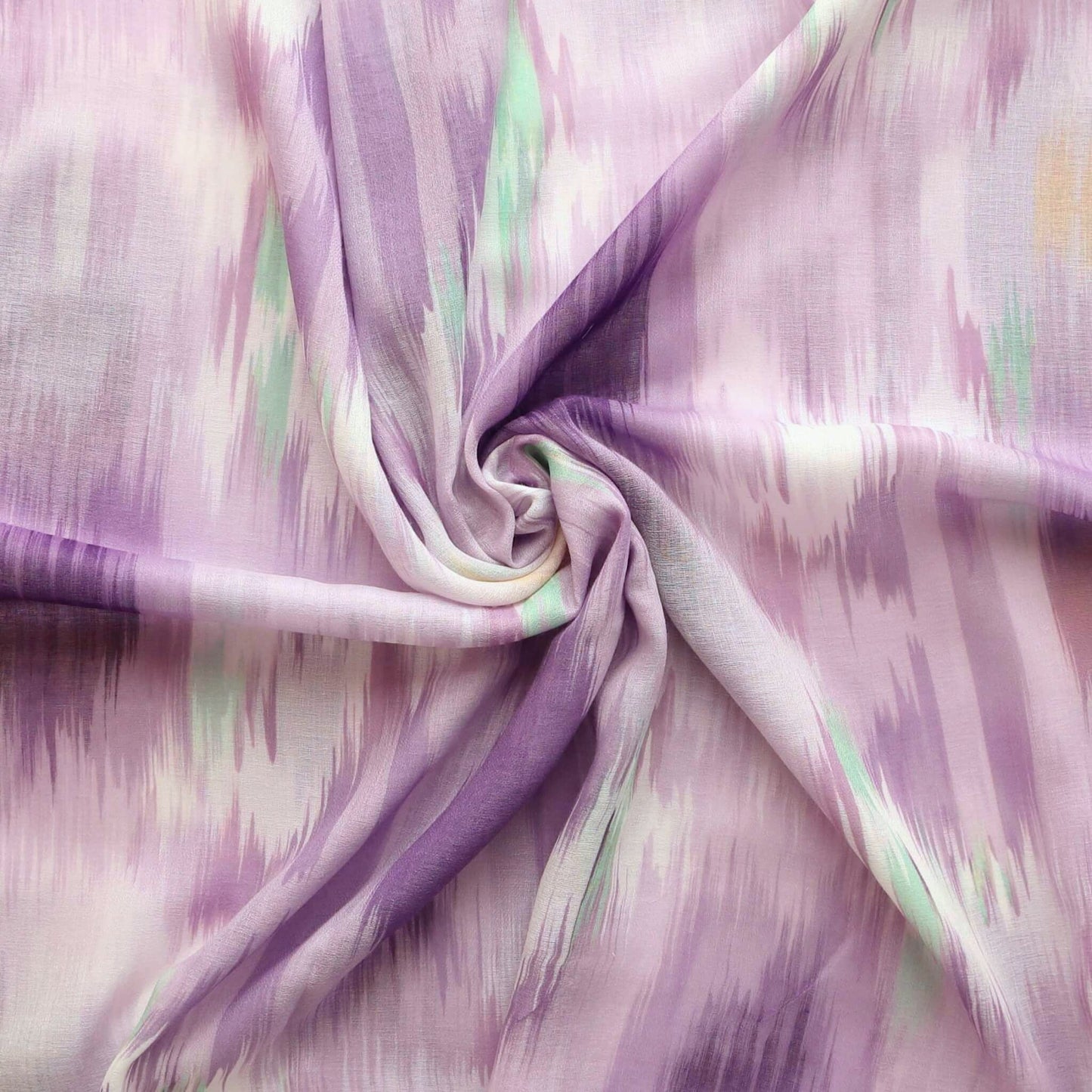 Lightweight scarf fabric with an abstract ikat-style design in flowing strokes of lavender, white, and soft teal.