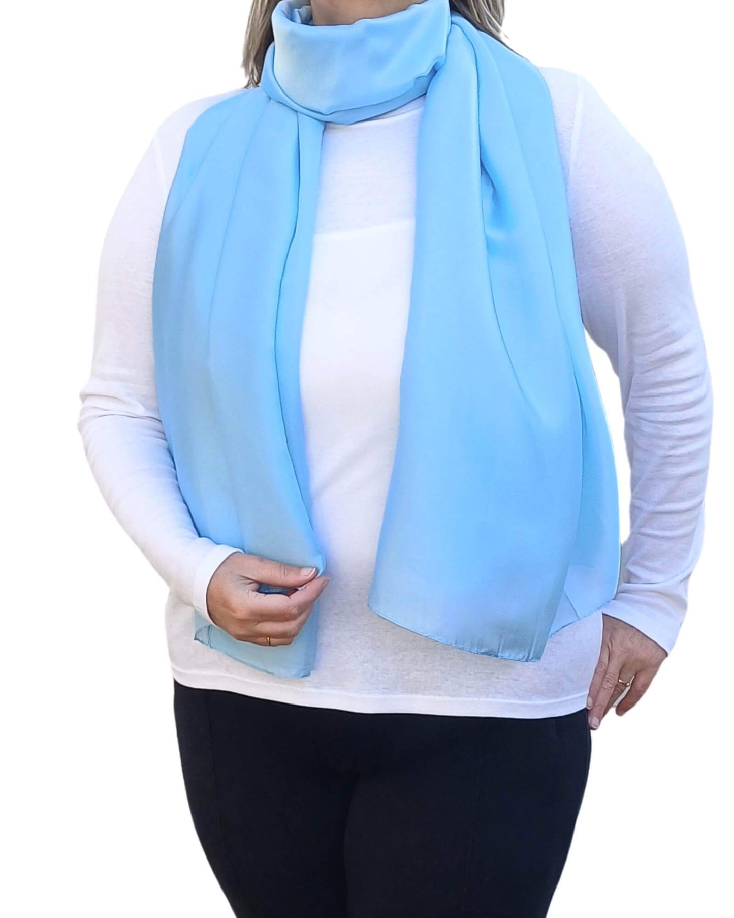 Aurora's Array Elegant Satin Shawl: Woman models a soft, sky blue silky scarf wrapped around her neck over a white top.