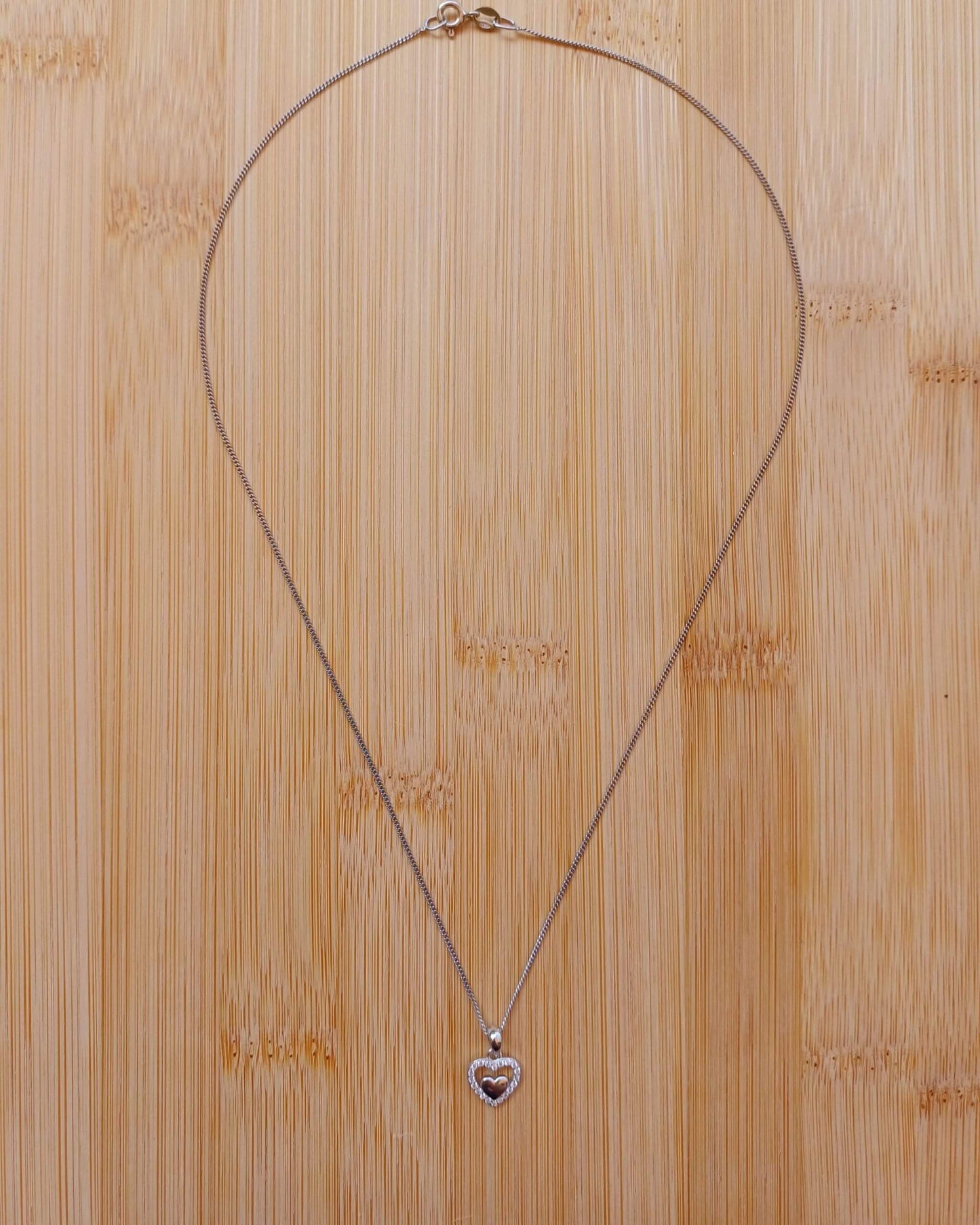 925 Silver Clear Cubic Zirconia Heart Pendant on an 18-inch rhodium-plated Sterling Silver curb chain - silver-clear-cubic-zirconia-heart-pendant-