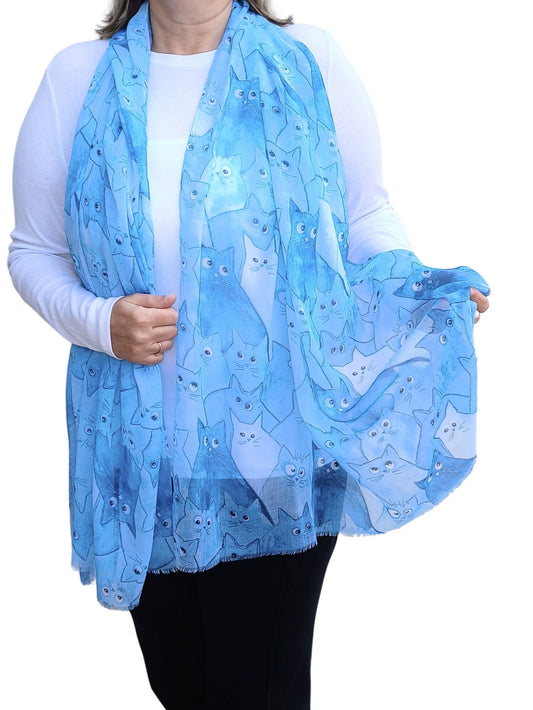 Blue scarf with an adorable all-over cat design in various blue and white hues. Soft and lightweight fashion wrap.