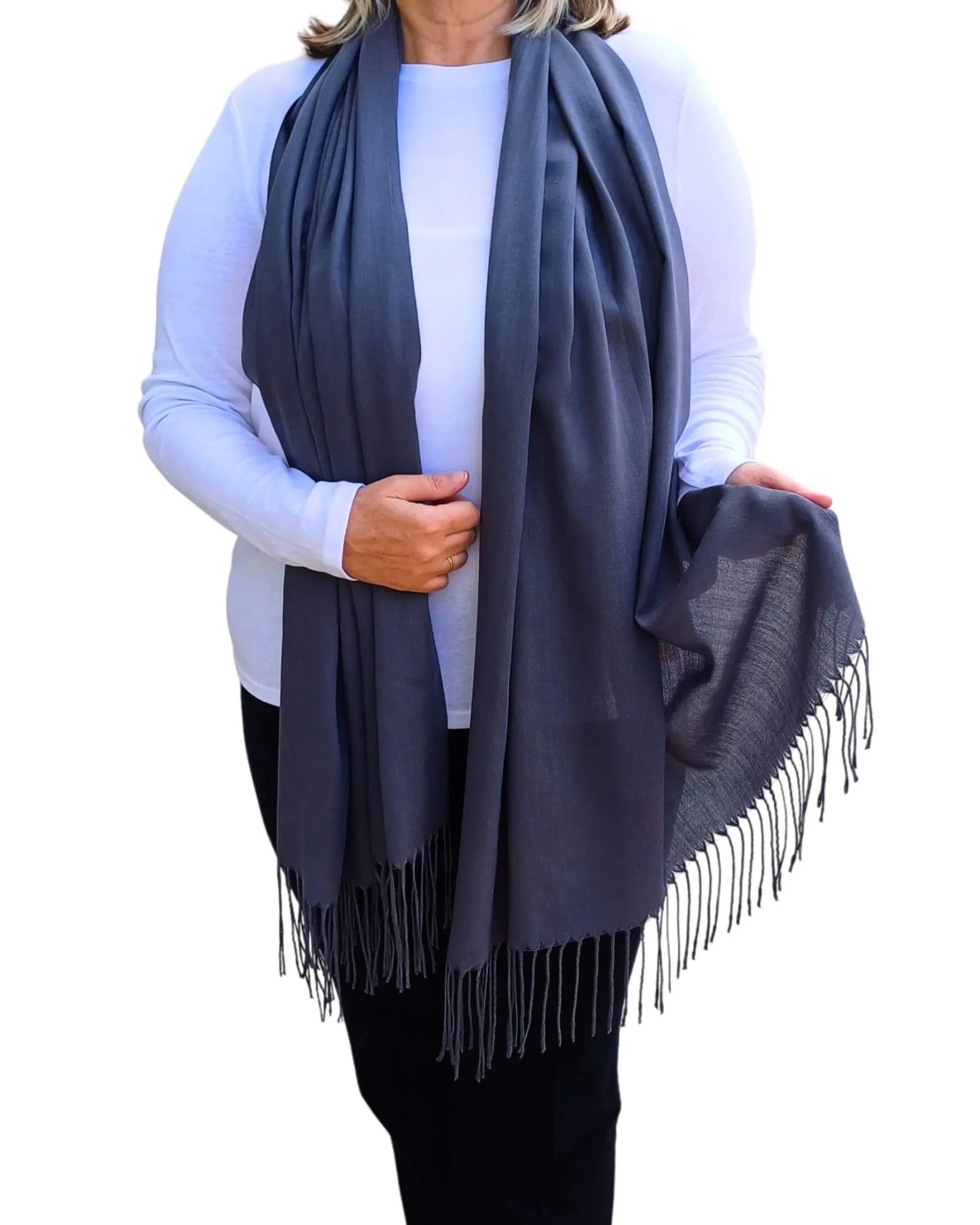 Model wearing graphite grey pashmina shawl – soft lightweight wrap with tassels, UK brand