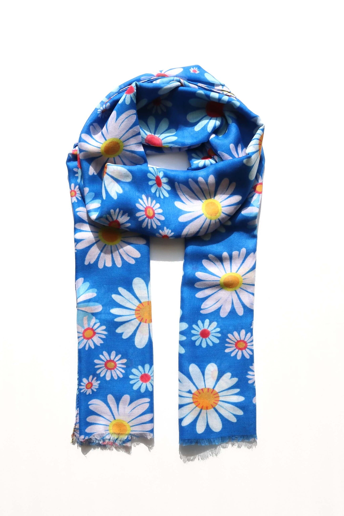 Bright blue scarf with a cheerful pattern of white daisies with yellow and pink centers. Lightweight, soft fabric.