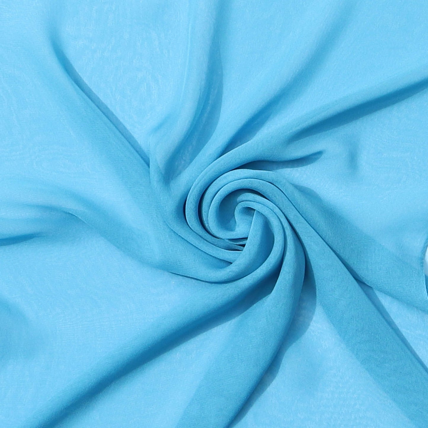 Light blue chiffon scarf close-up – delicate fabric swirl, lightweight summer-to-winter scarf from Aurora’s Array, perfect pastel accessory