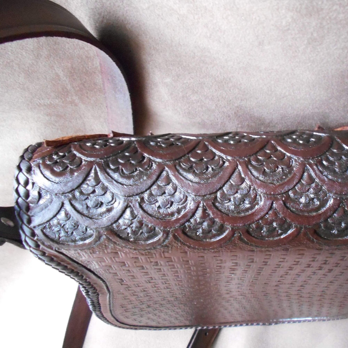 Top and back view of owl crossbody bag showing scaled leather tooling