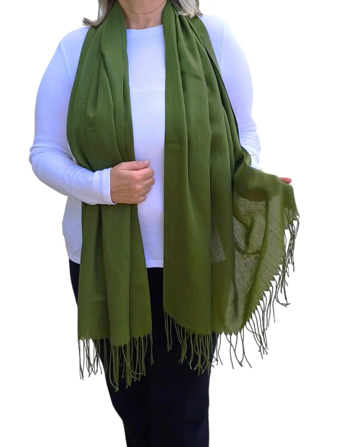 Model wearing olive green pashmina shawl – soft lightweight wrap with tassels, UK brand