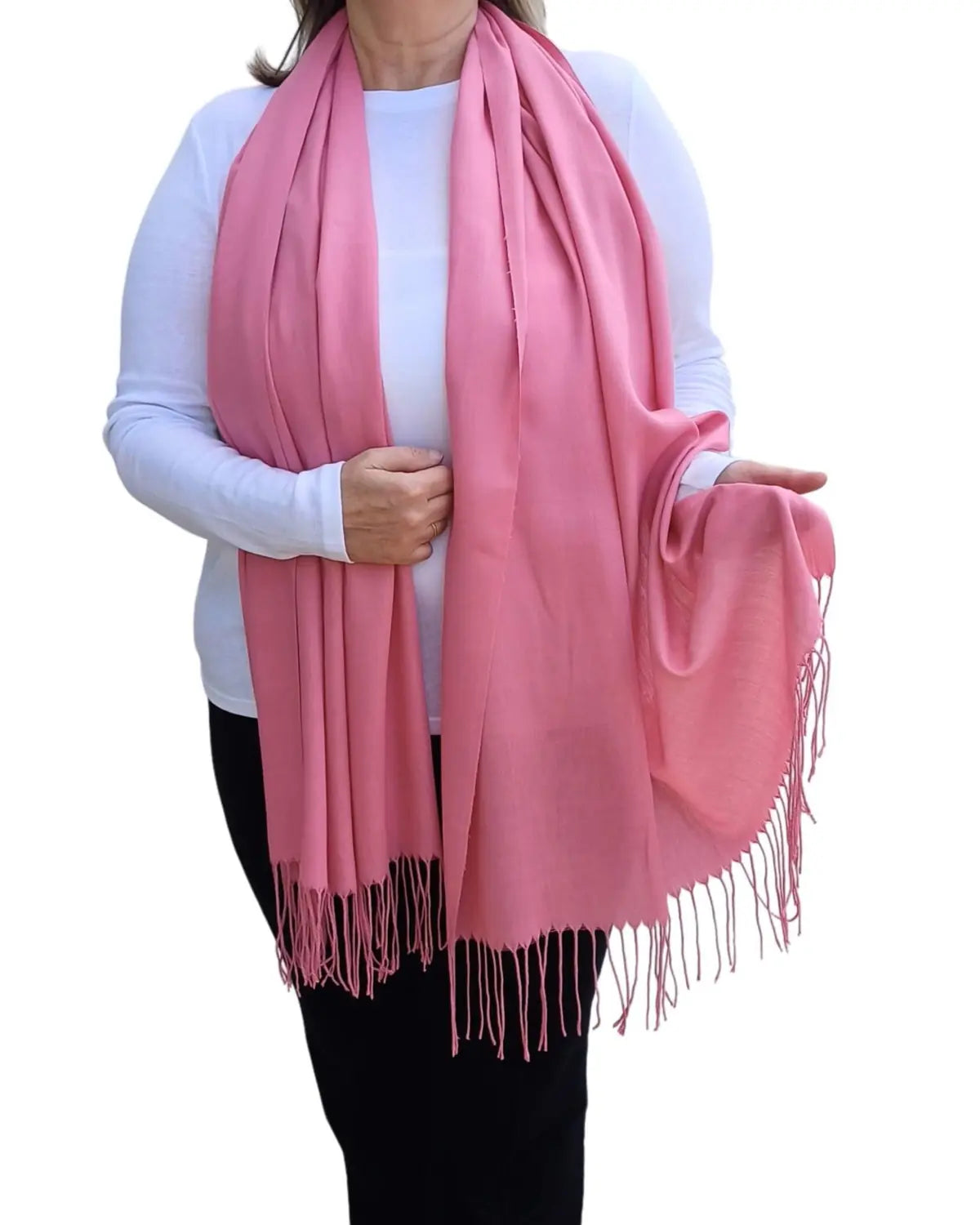 Model wearing pink pashmina shawl – soft lightweight wrap with tassels, UK brand