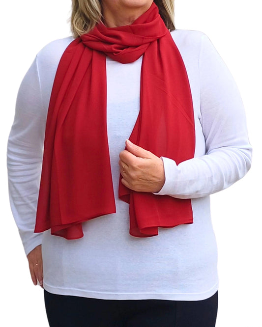 Red chiffon scarf draped on model soft georgette accessory styled over white top