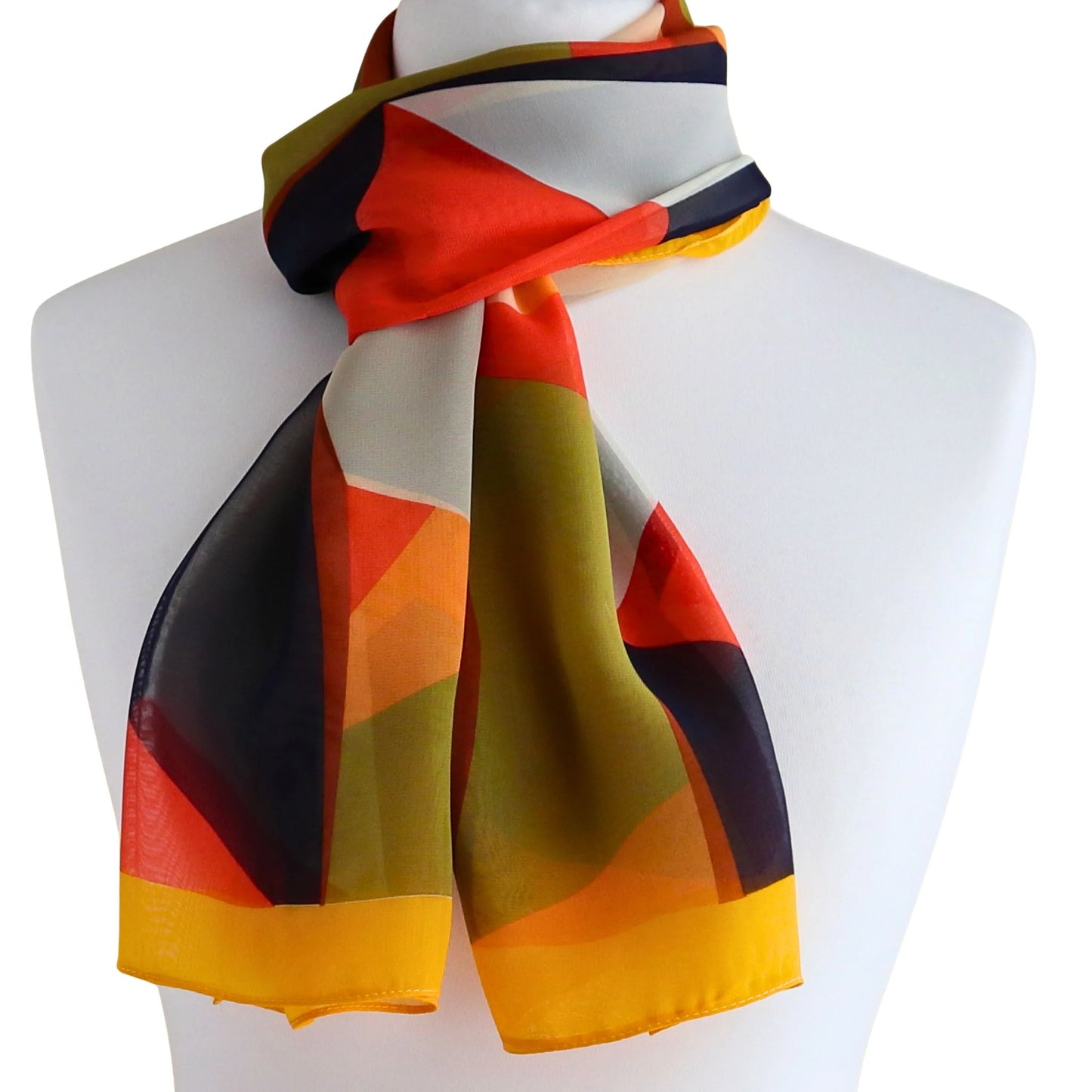 Lightweight chiffon-style scarf tied at the neck in mustard yellow geometric print