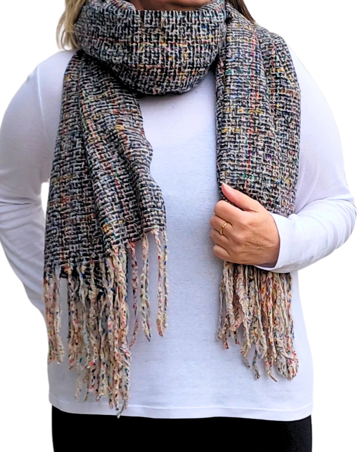 Soft woven black winter scarf with tassels from Auroras Array wrapped around the neck ideal for winter layering