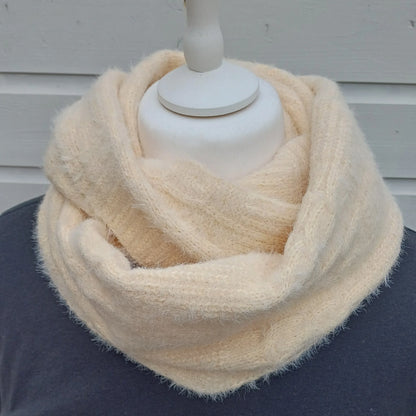 Cream knitted snood scarf wrapped twice around a mannequin