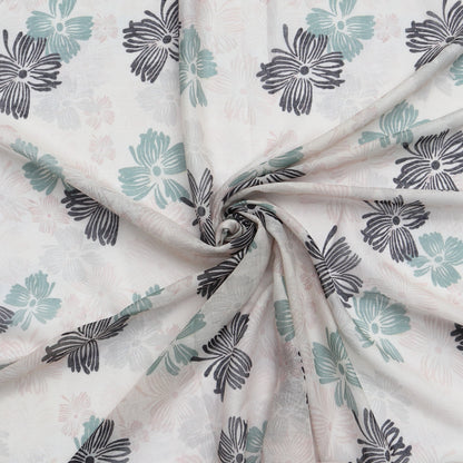Aurora's Array: Close-up of a lightweight pale pink scarf with a floral print in shades of grey, blue, and green, swirled to show detail.