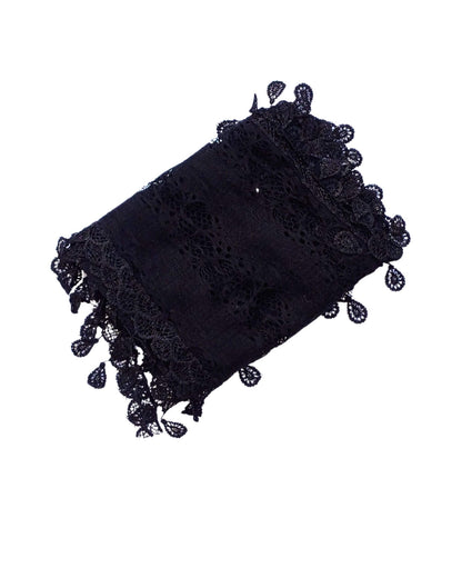 Aurora's Array: A sophisticated black lace scarf, folded to show its delicate leaf-like pattern and fringed edges.