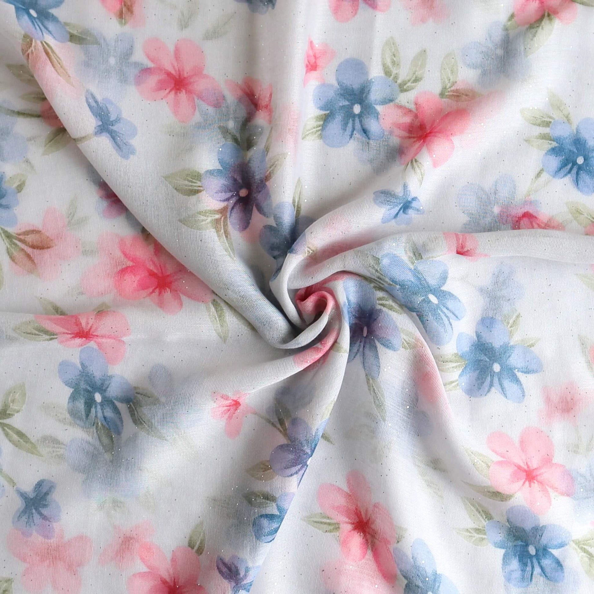 Aurora's Array: Close-up of a soft, lightweight white scarf with a pink and blue floral print, swirled to show detail.