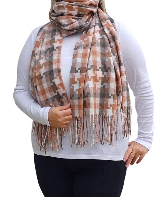 Aurora's Array: Woman models a soft, patterned winter scarf in shades of  peach, brown, grey, and cream with fringed edges, wrapped around her neck.