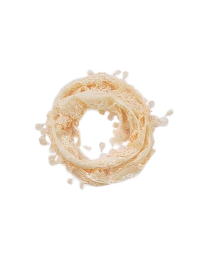 Aurora's Array: A soft cream-coloured scarf made of delicate lace with a leaf-like pattern and fringed edges, forming a circular shape.