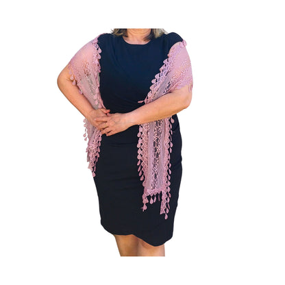 Aurora's Array: Woman models a soft mauve-coloured, light pink lace scarf with a delicate leaf-like pattern and fringed edges.