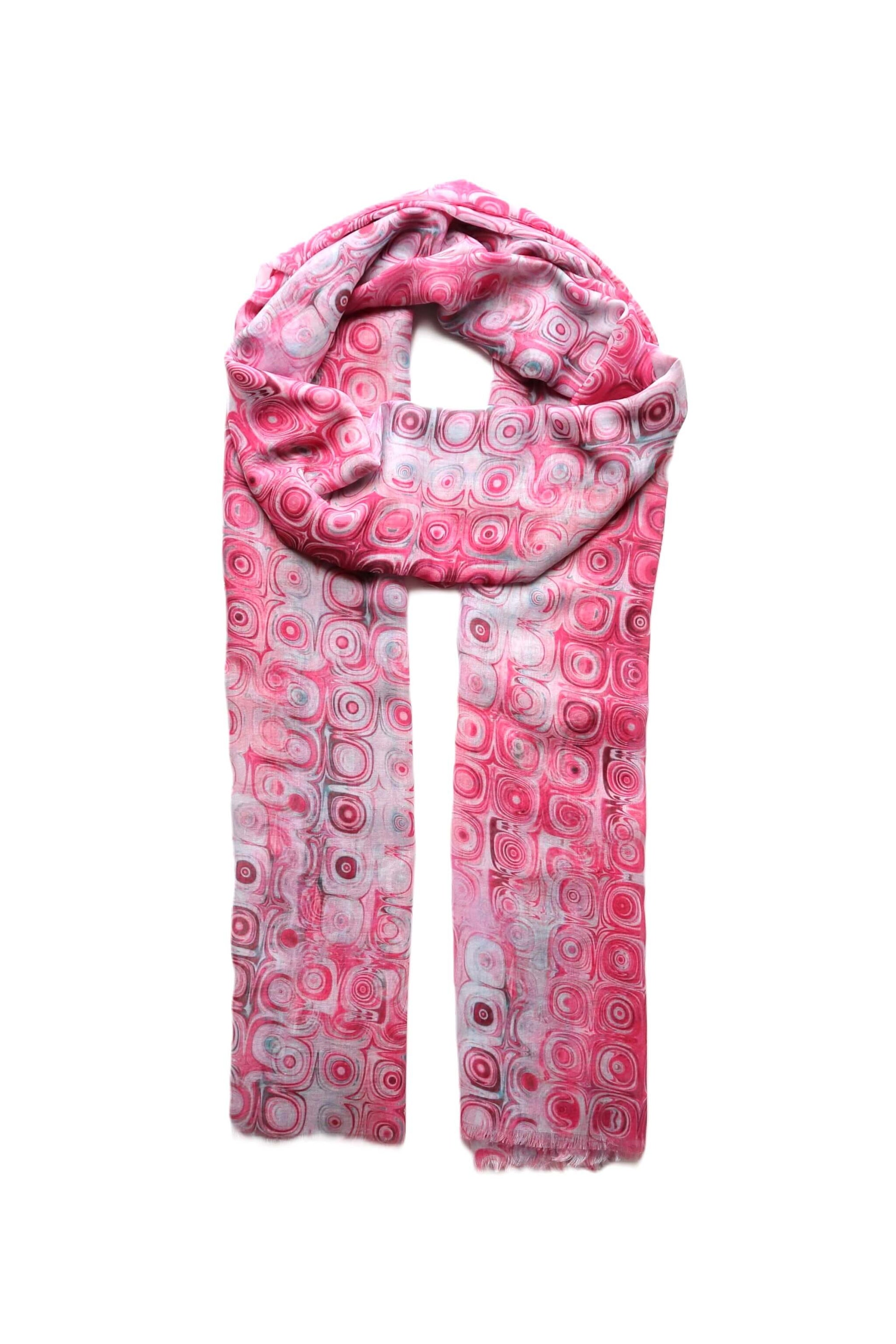 Bright pink scarf with a retro-inspired circle pattern in varying pink and white hues. Lightweight and stylish neckwear.