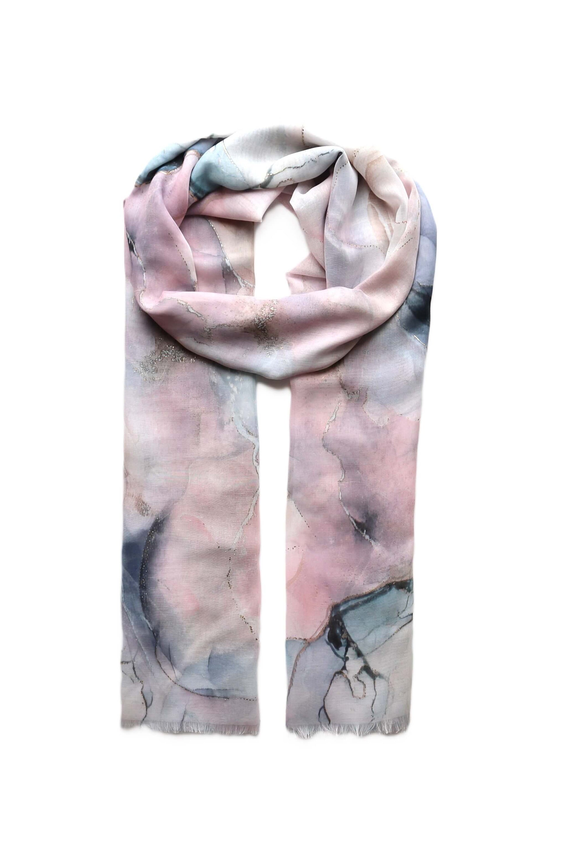 Lightweight summer scarf with a delicate marble pattern in blue, pink, and cream, featuring subtle gold shimmer threads. Elegant and soft wrap.