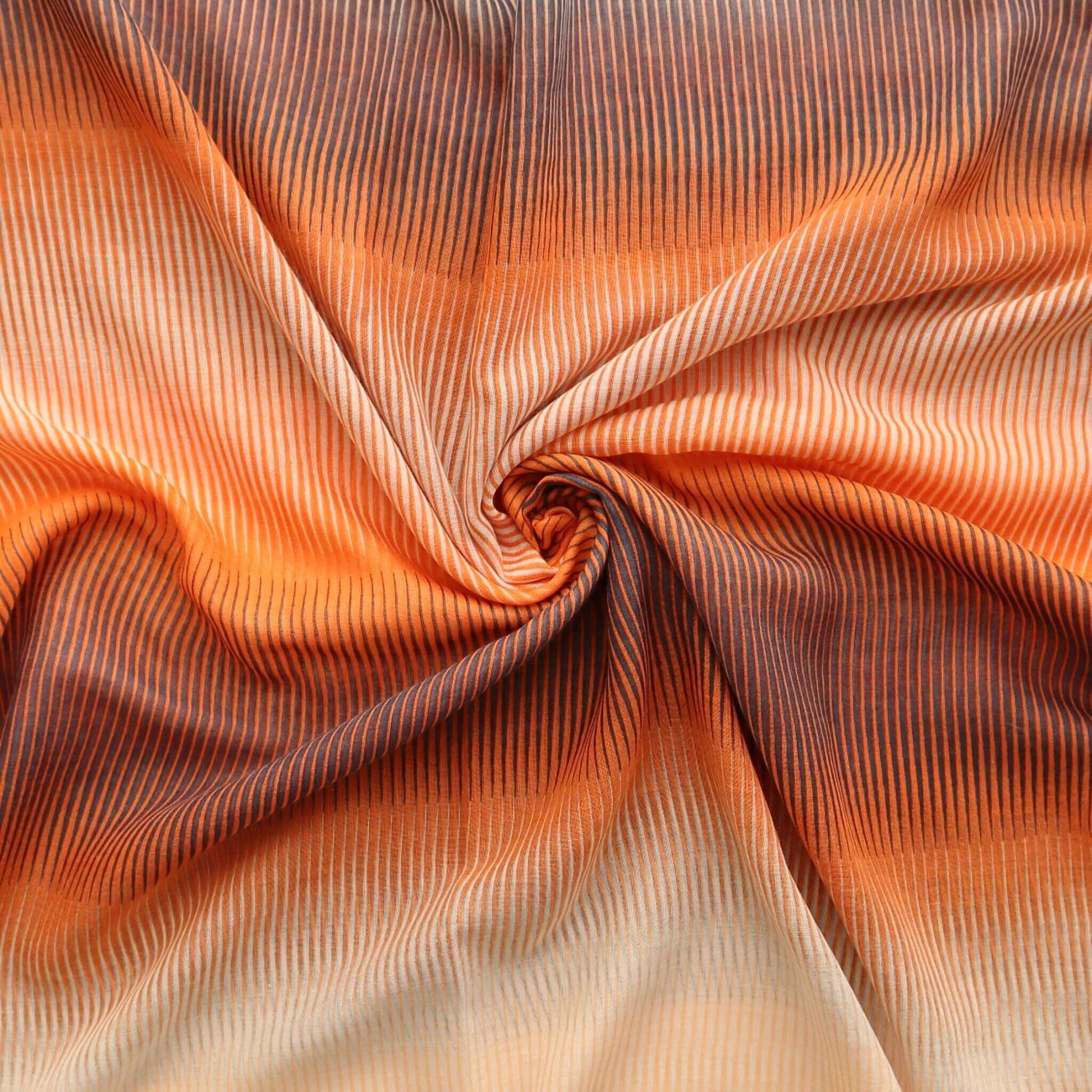 Flowing scarf fabric with an ombre gradient from dark grey to bright orange and light cream, featuring a subtle, textured stripe design.