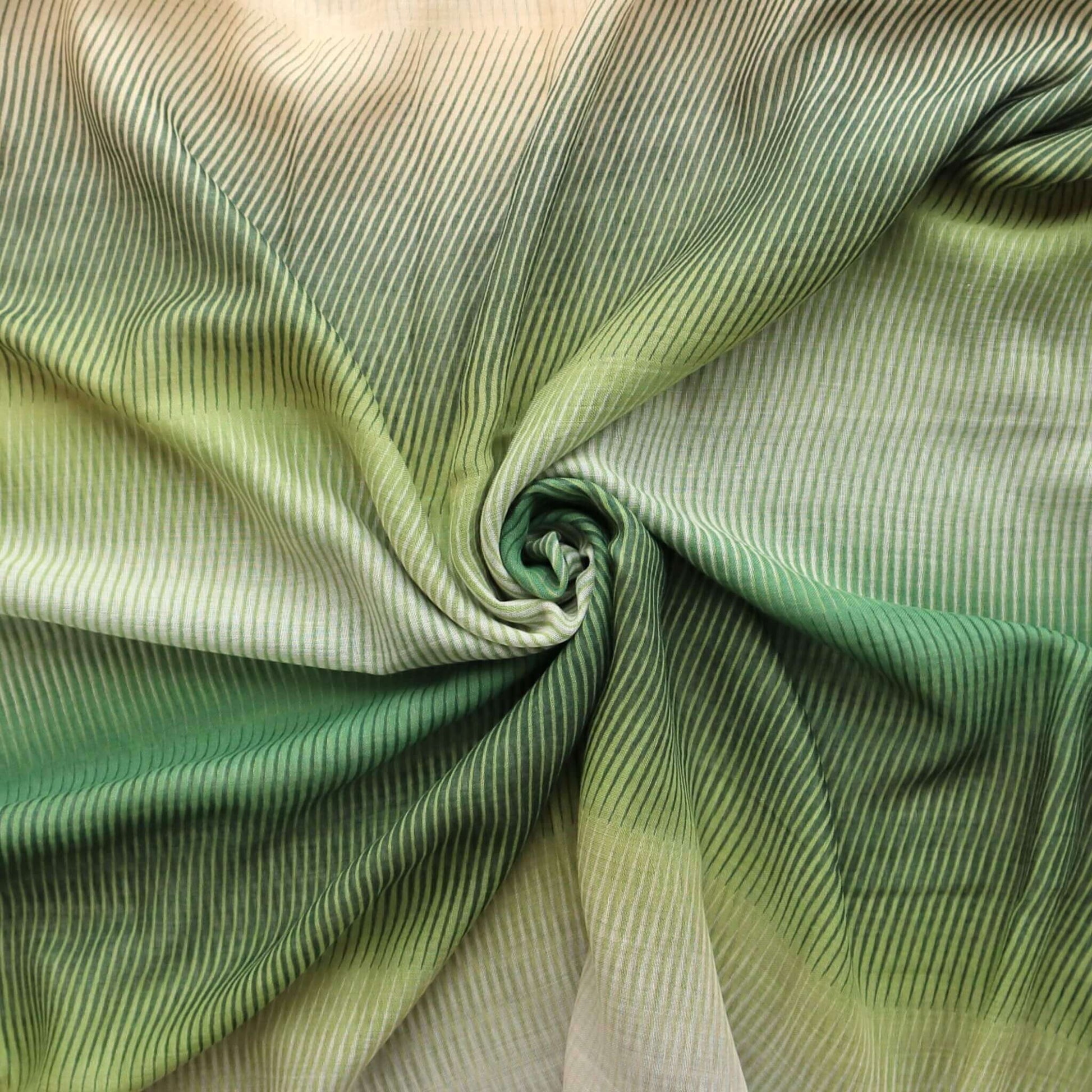 Softly draped scarf fabric with a flowing stripe texture and a subtle ombre effect from deep green to pale cream.