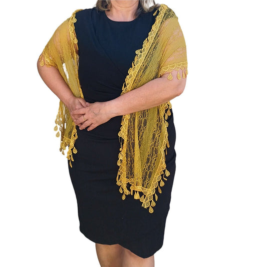 Aurora's Array: Woman models a vibrant mustard yellow lace scarf with a delicate leaf-like pattern and fringed edges.