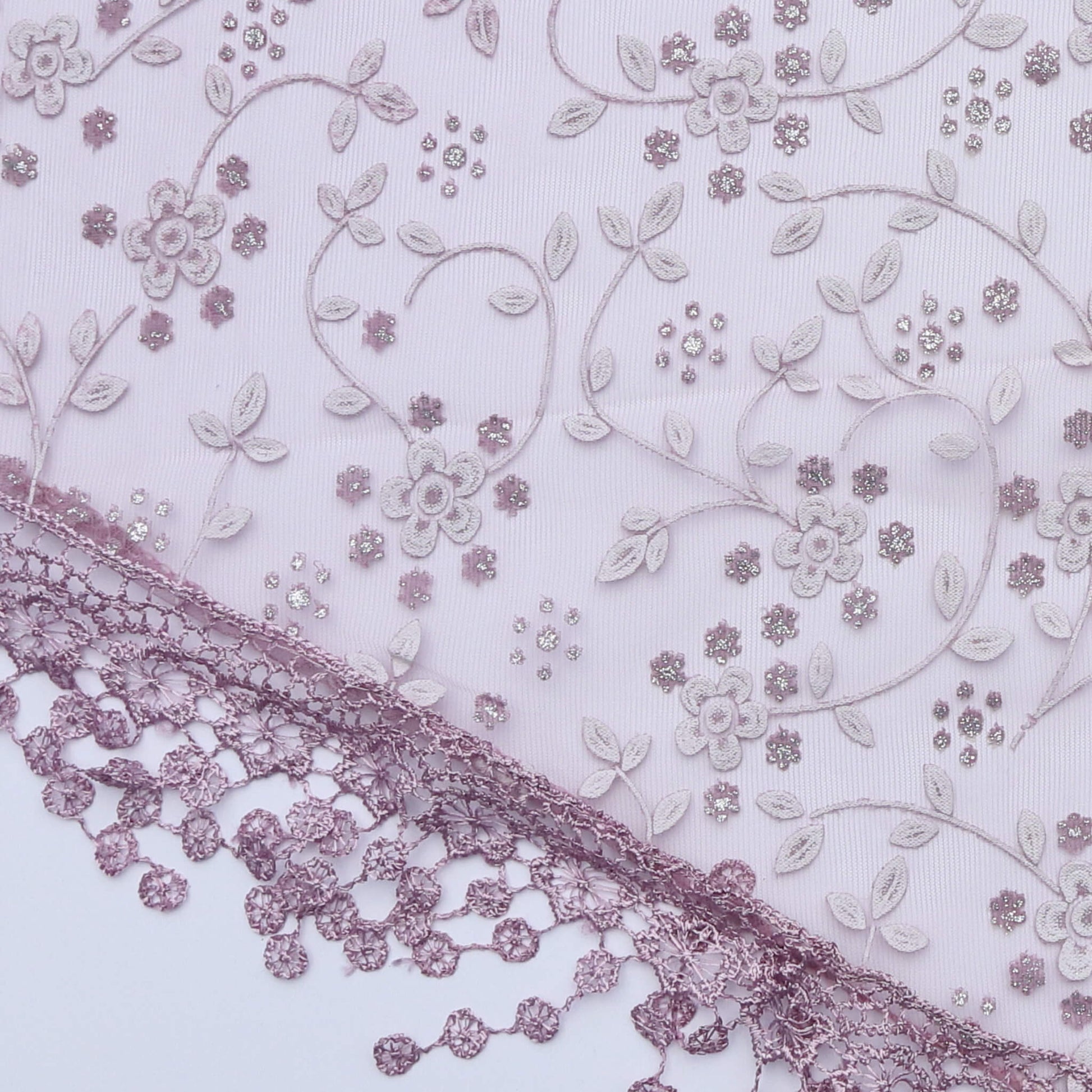 Aurora's Array Glitter Triangle Scarf with Lace & Embroidery (Close-up): A detailed close-up of a light purple, sheer fabric with delicate white floral embroidery accented with subtle glitter. The edge features intricate light purple lace trim with dangli