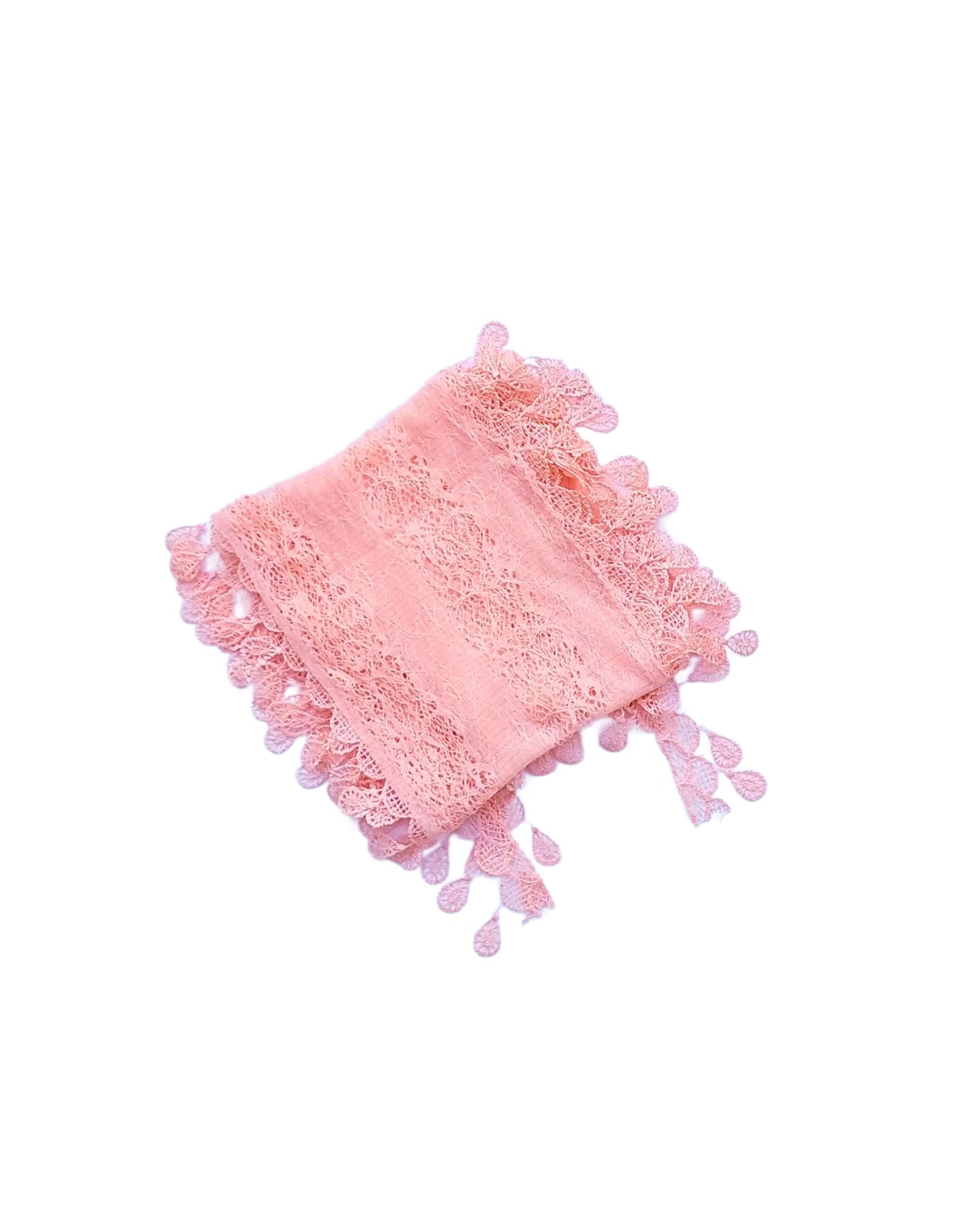 Aurora's Array: A soft peach-coloured lace scarf, folded to show its delicate leaf-like pattern and fringed edges.