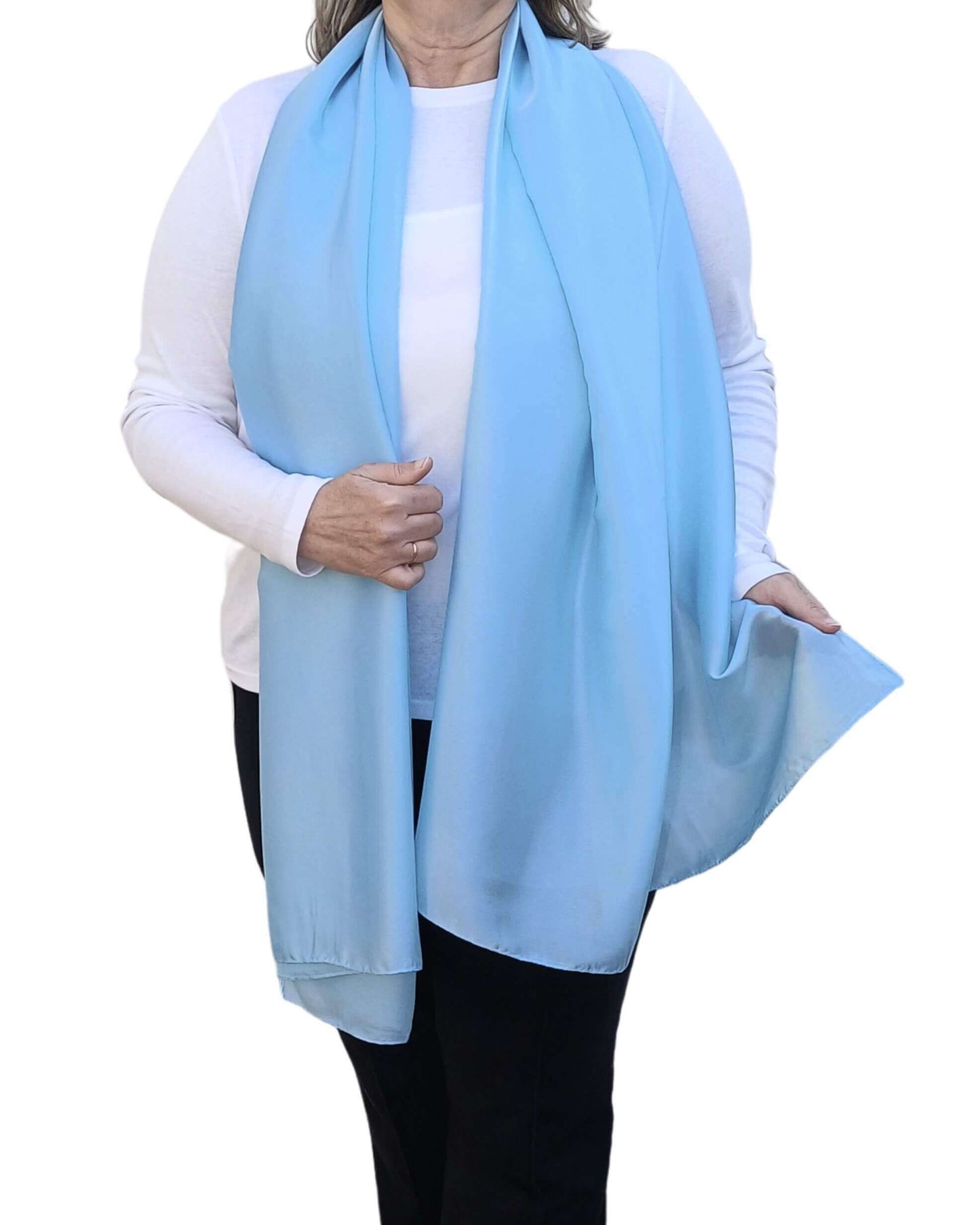 Aurora's Array Elegant Satin Shawl: Woman models a soft, sky blue silky shawl draped over a white top.