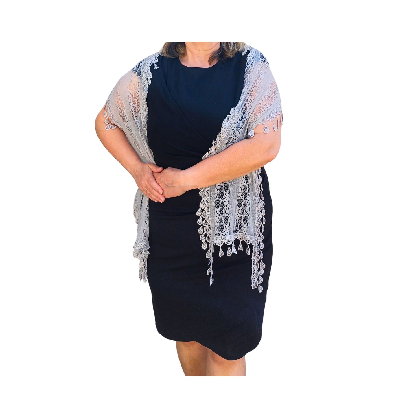 Aurora's Array: Woman models a soft taupe-coloured, light pink lace scarf with a delicate leaf-like pattern and fringed edges.